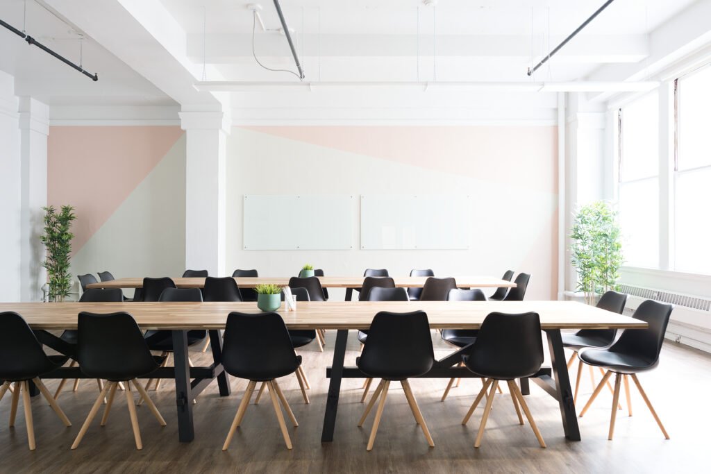 Empty boardroom with a long conference table and chairs, symbolizing corporate authority and power