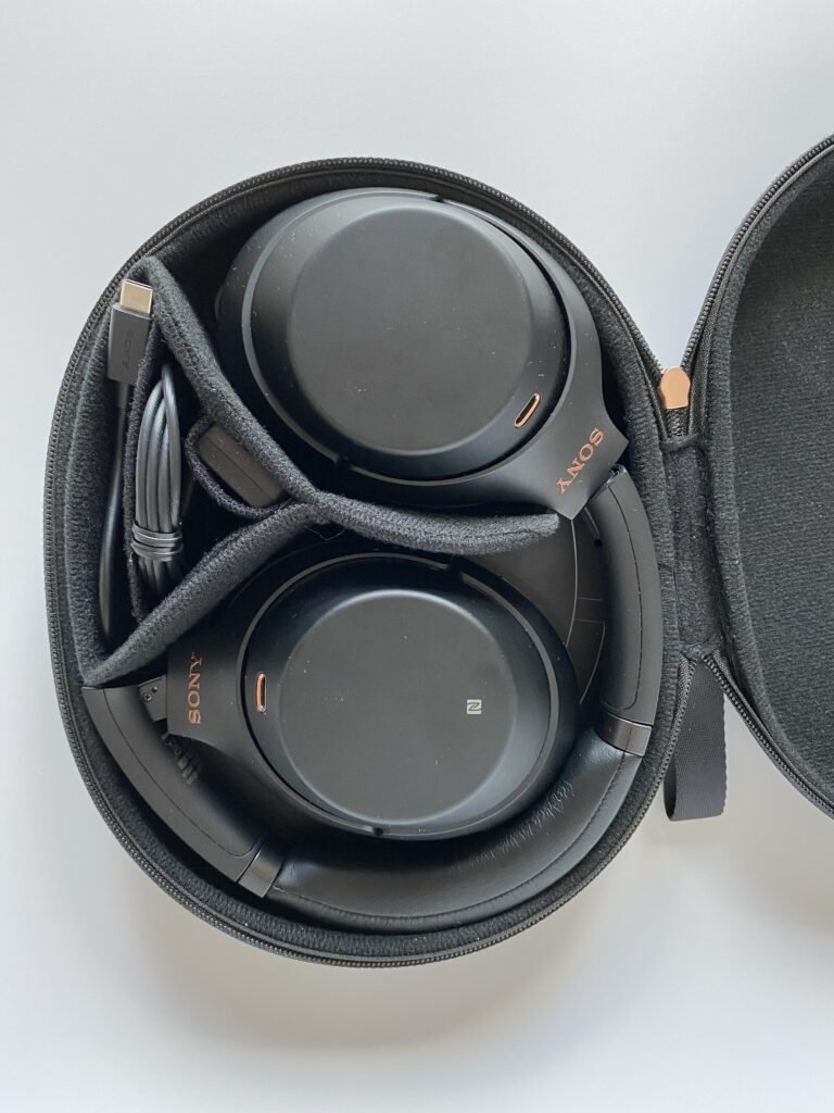 A pair of over-ear active noise-cancelling wireless headphones.