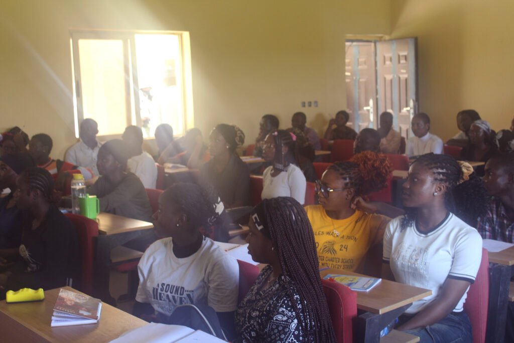 Students seated in a university classroom during a lecture.