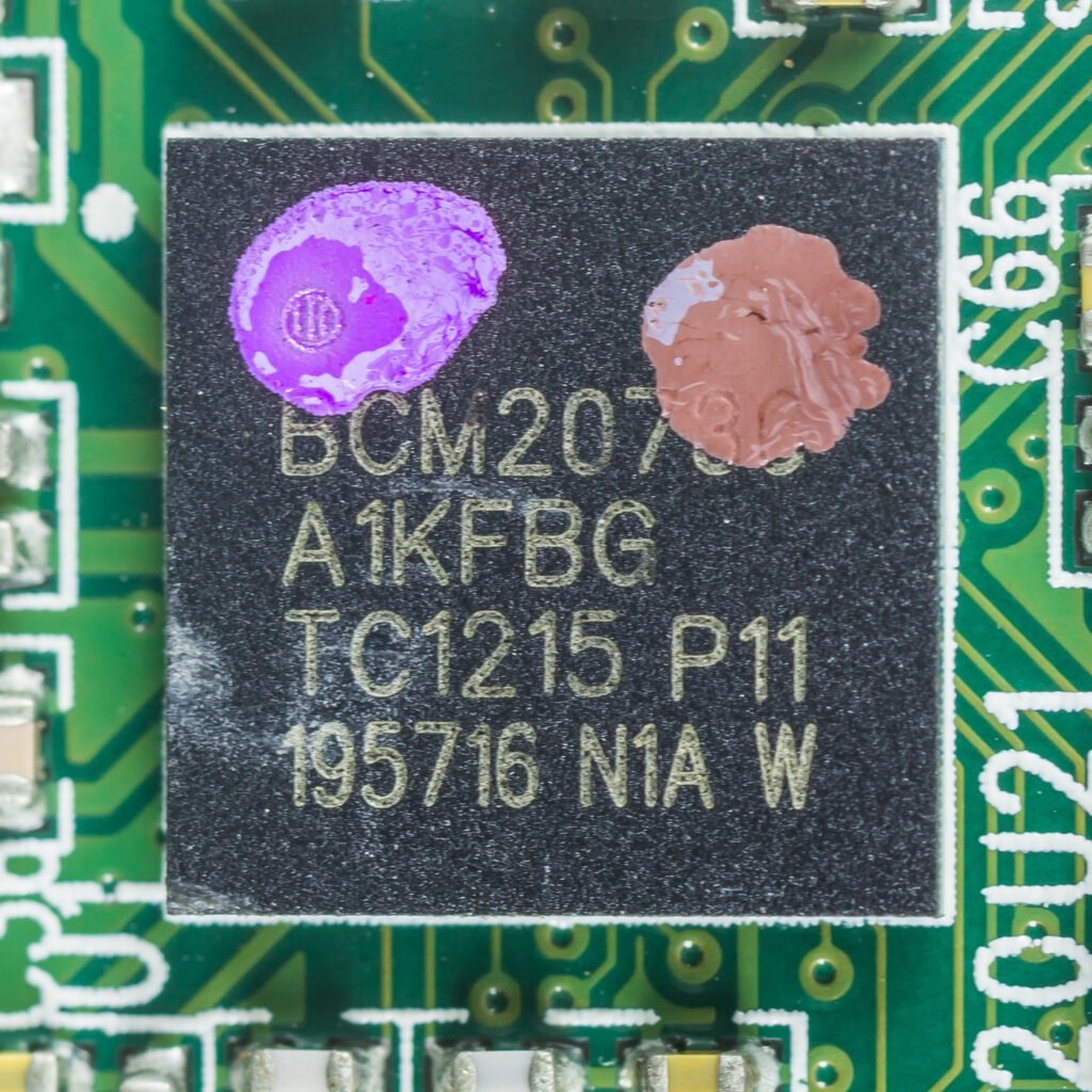 A close-up of a Bluetooth radio chip module mounted on a circuit board.