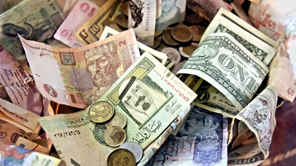 Stacks of assorted world currency banknotes representing foreign currency exchange rates