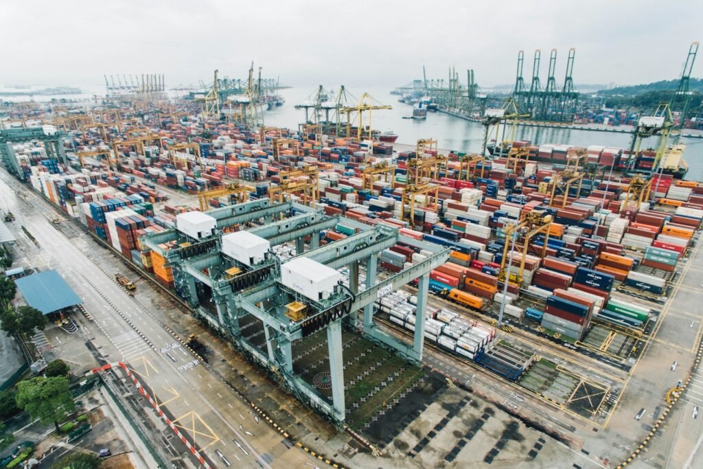 Stacked intermodal shipping containers on a dock at a cargo port