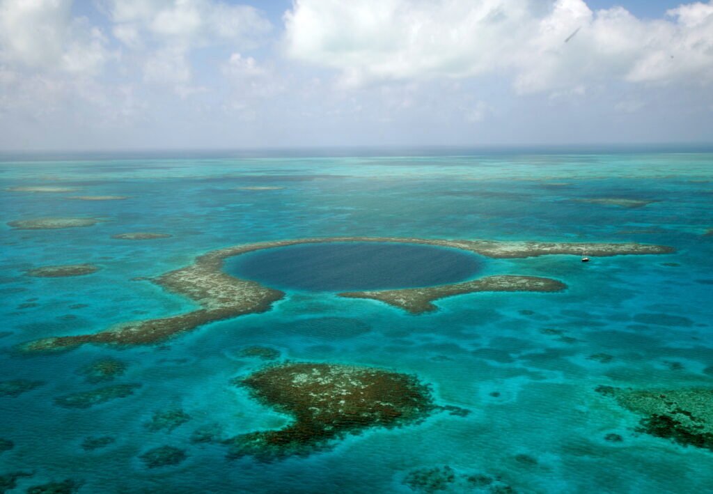 The Great Blue Hole, an iconic circular marine sinkhole within the Belize Barrier Reef, Belize