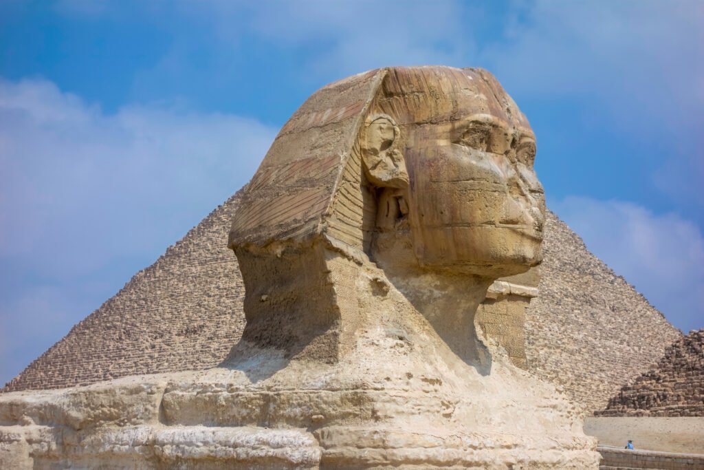 The Great Sphinx of Giza with the Great Pyramid in the background, Egypt