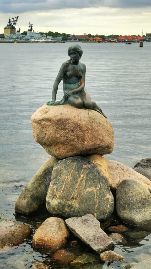 The Little Mermaid statue in Copenhagen harbor, an iconic bronze landmark in Denmark