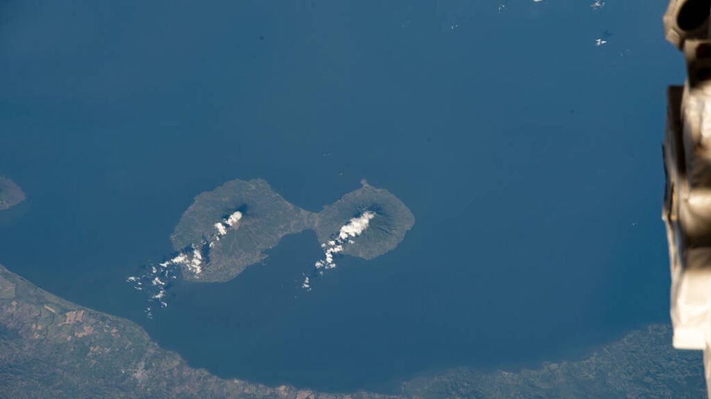 Aerial astronaut photograph of Ometepe Island's twin volcanoes, Concepcion and Maderas, rising from Lake Nicaragua
