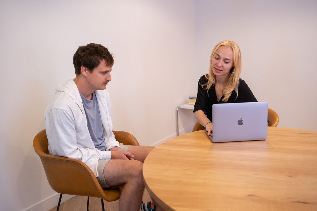 Colleagues engage in an open, candid discussion during a meeting, the kind of exchange psychological safety at work makes possible.