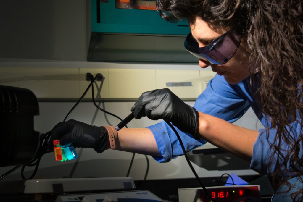 A scientist conducts a laboratory experiment as part of the scientific method.