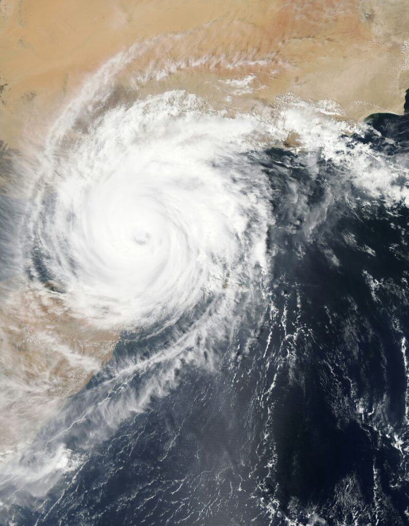 Satellite view of a tropical cyclone spiral over the ocean