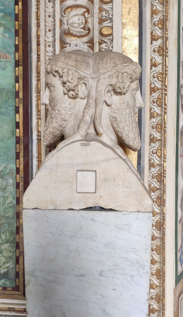 A bust of Janus, the two-faced Roman god of beginnings and doorways, for whom January is named.
