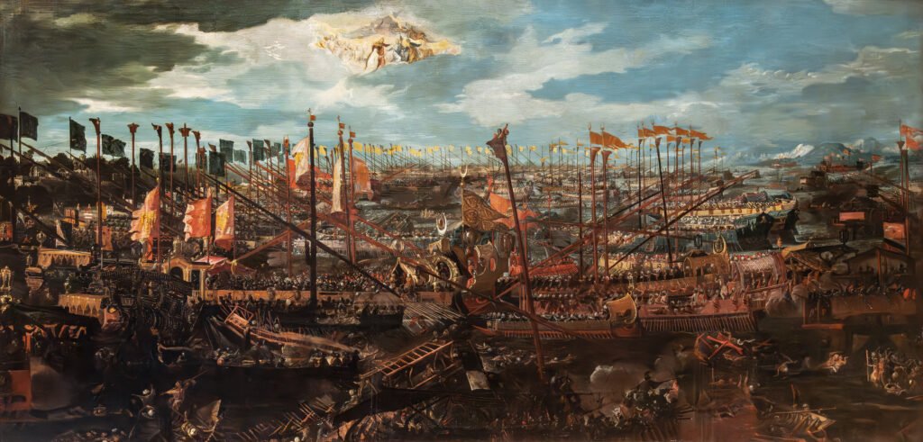 A large oil painting depicting the Battle of Lepanto, with dozens of galleys locked in close combat under a smoke-filled sky.