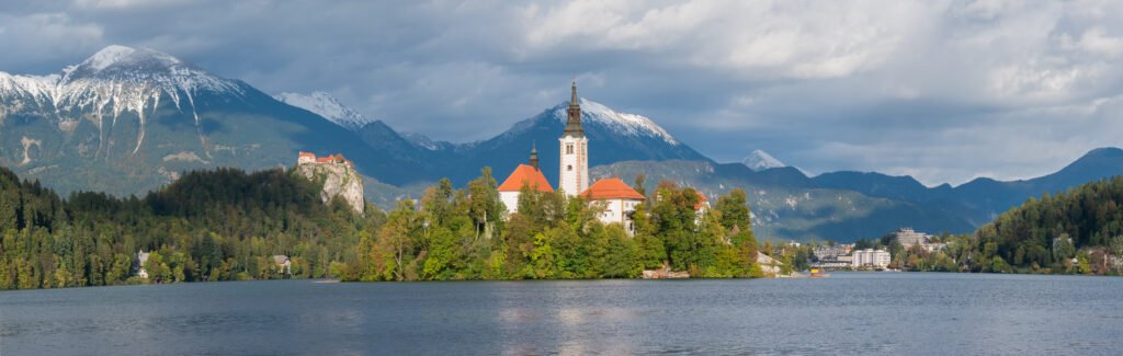 Bled Island with its church and Bled Castle on the cliff above, Lake Bled, Slovenia