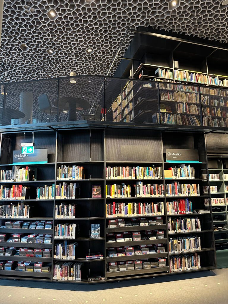 Shelves of books in a library, the setting where questions about what counts as knowledge are studied