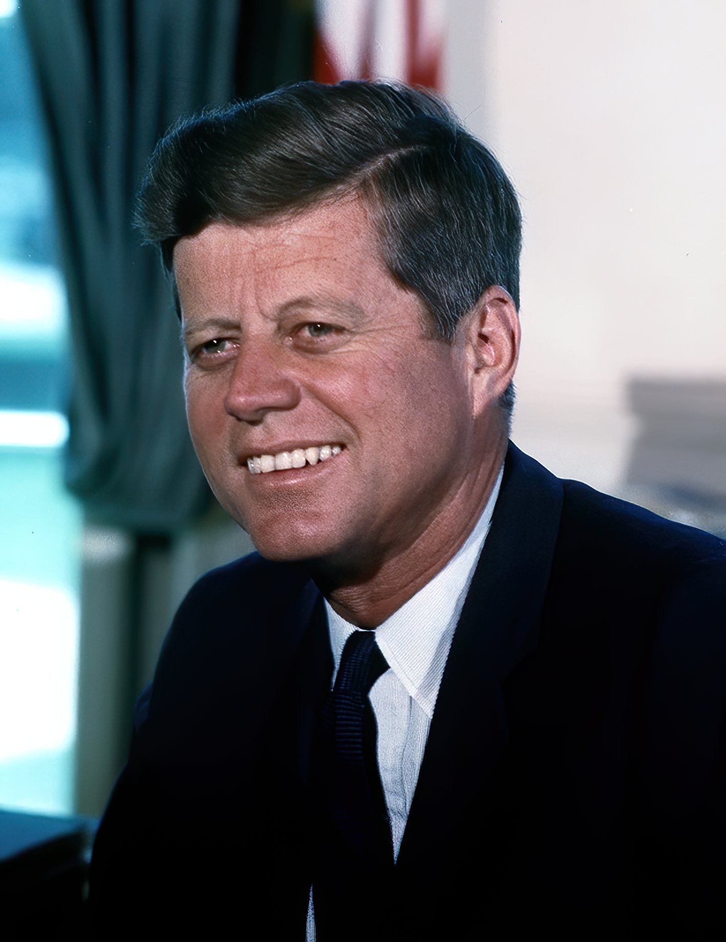 Formal color photograph portrait of President John F. Kennedy