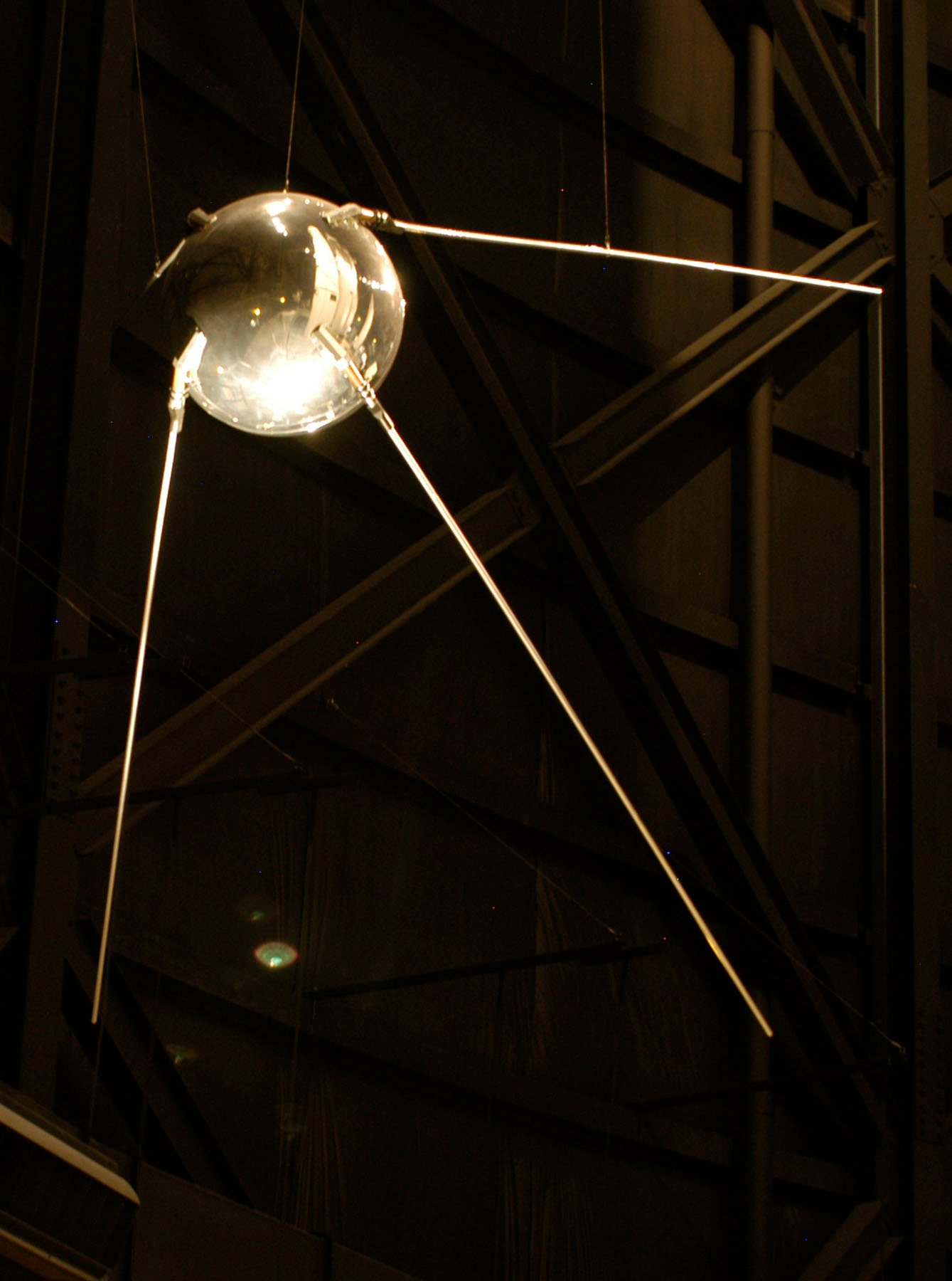 Replica of the spherical Sputnik 1 satellite with four long antennas, on display at the National Museum of the United States Air Force.