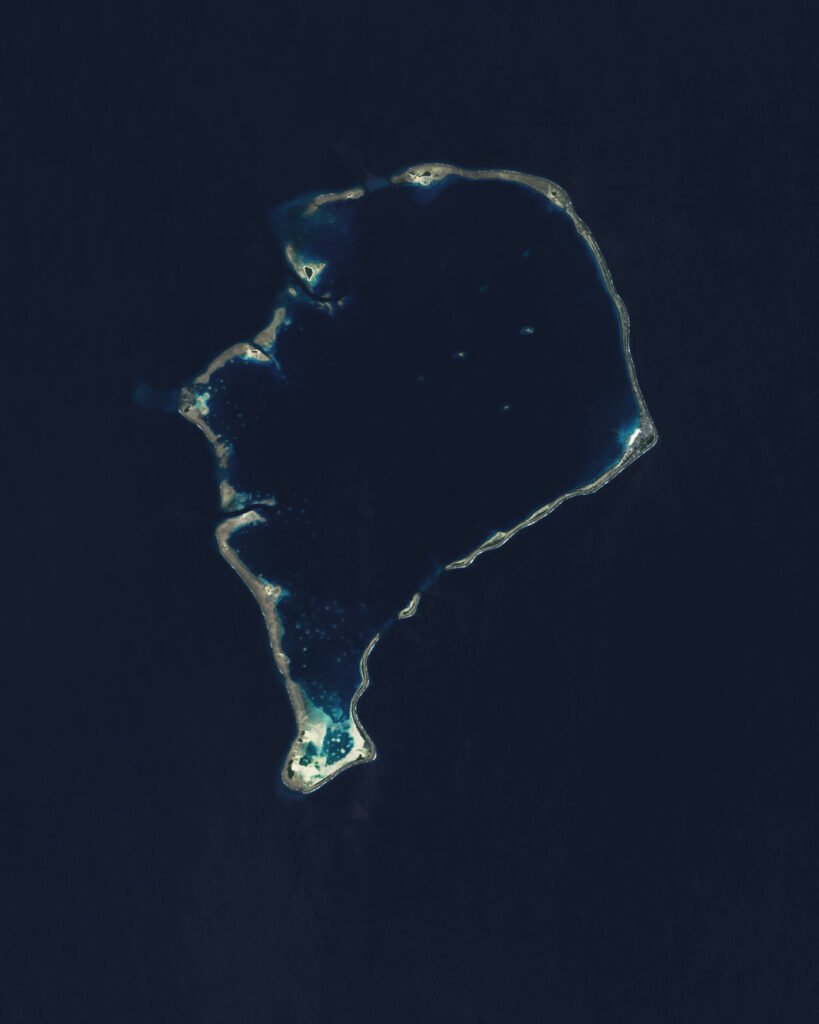 Aerial satellite view of Funafuti Atoll, Tuvalu, showing its narrow ring of land enclosing a central lagoon