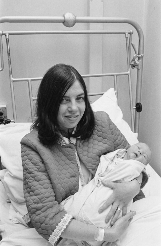 Newborn babies in cots in a hospital maternity ward